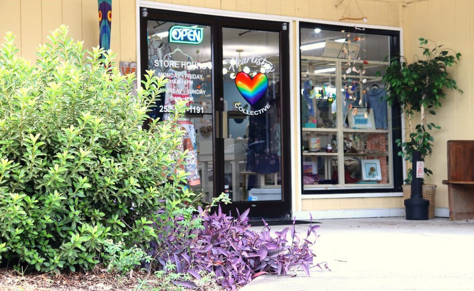 Heartistry Collective storefront with the rainbow heart on the door